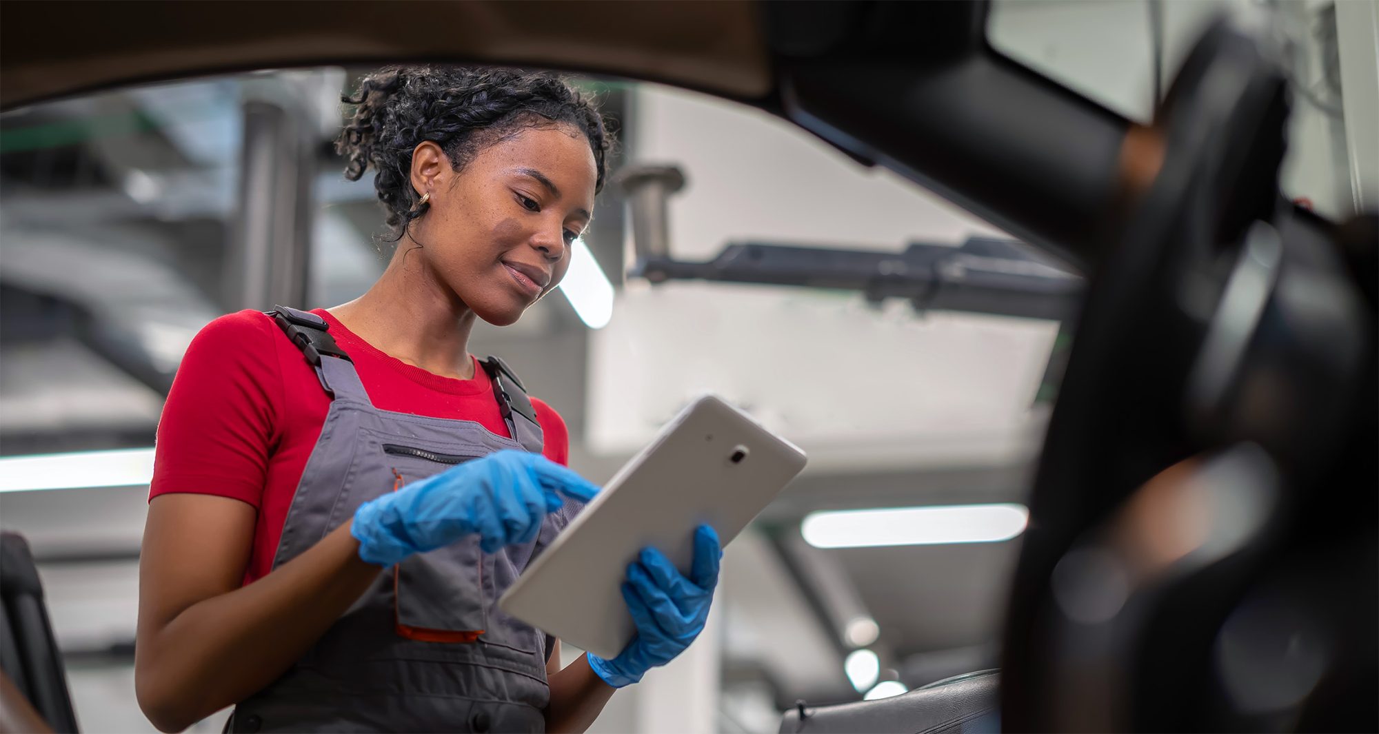 Analyst reviewing AI in automotive insights drawn from connected vehicle data