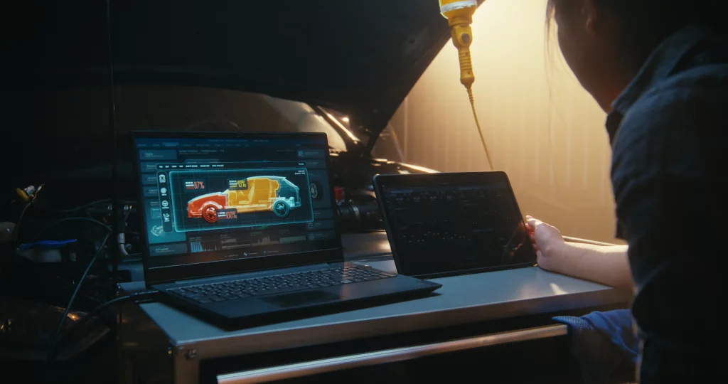 EM engineer reviewing connected vehicle data from vehicles in service on a dashboard